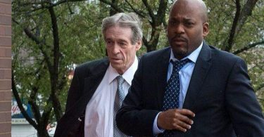 Glastonbury businessman Bruce Bemer, left, walks into Superior Court in Danbury where he appeared on sex trafficking charges. (Patrick Raycraft / Hartford Courant)