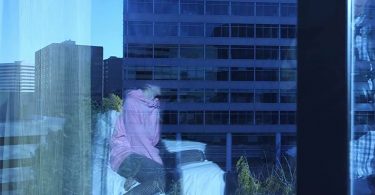 A young person sits on a bed during Operation Cross Country XI. FBI